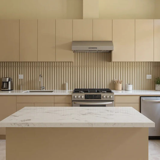 Modern kitchen with beige cabinets, marble island, and stainless steel appliances.