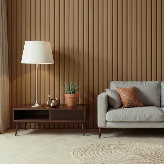 Modern minimalist living room with mid-century furniture, featuring a light gray sofa, brown accent pillow, wooden slat wall, floor lamp, indoor plant, and circular beige rug on herringbone flooring.