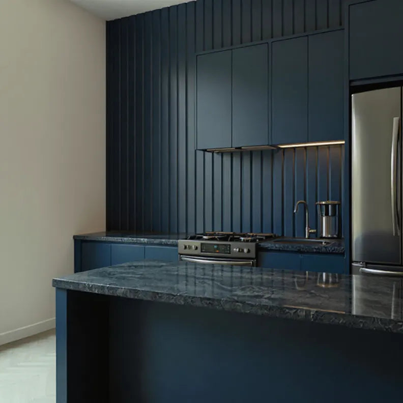 Modern kitchen with dark blue cabinets and granite countertops and dark blue ribbed wall panels