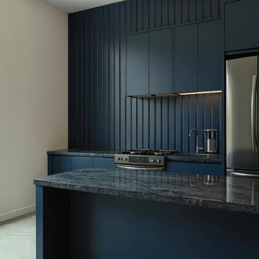 Modern kitchen with dark blue cabinets and granite countertops and dark blue ribbed wall panels